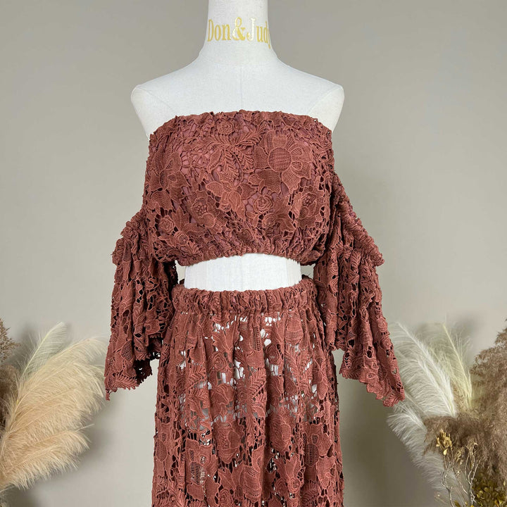 The Bendis, terracotta two-piece lace maternity photography set displayed on a mannequin, featuring an off the shoulder ruffled crop top details.