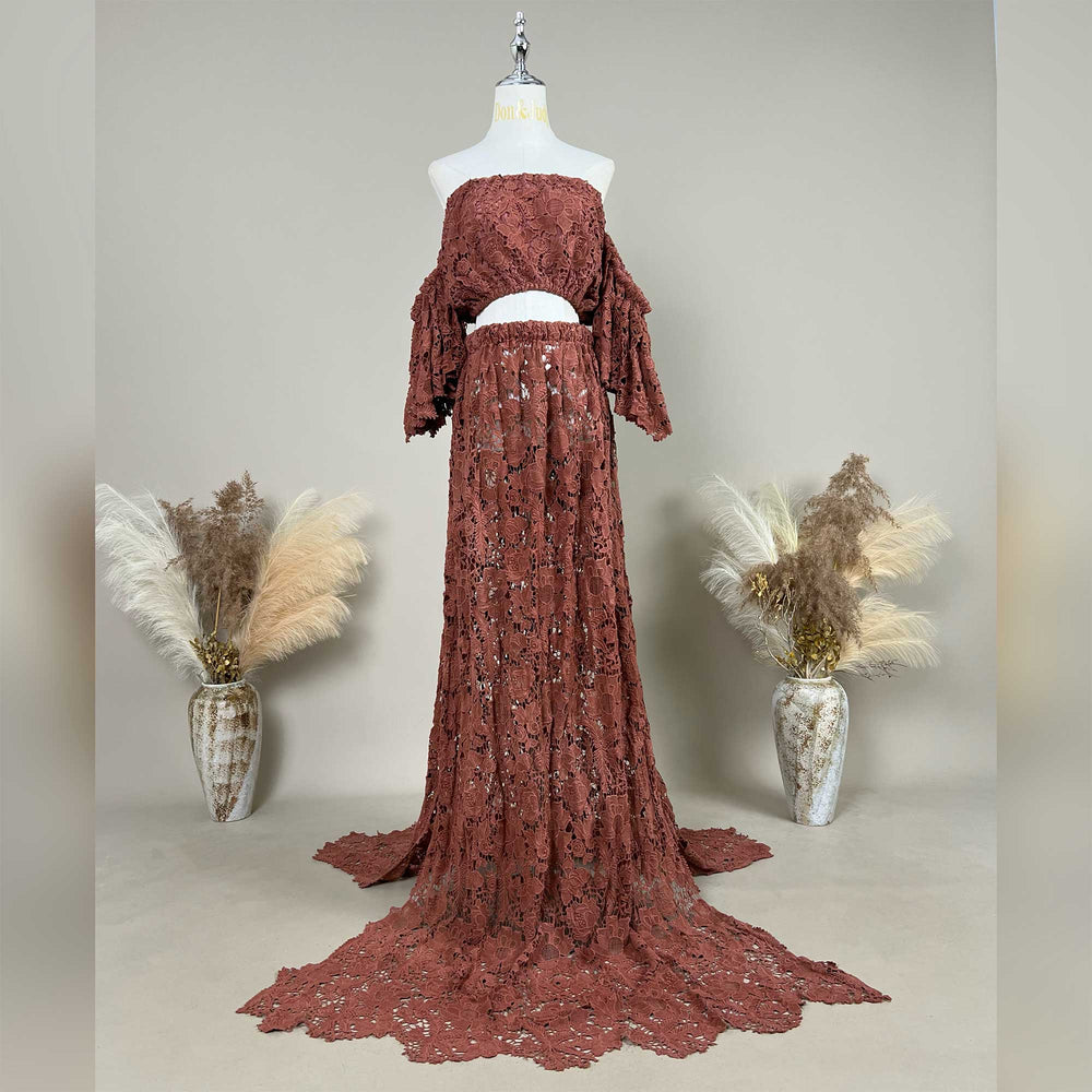 The Bendis,terracotta two-piece lace maternity photography set displayed on a mannequin, featuring an off-the-shoulder ruffled crop top and a high-waisted floor-length skirt with a sweeping train