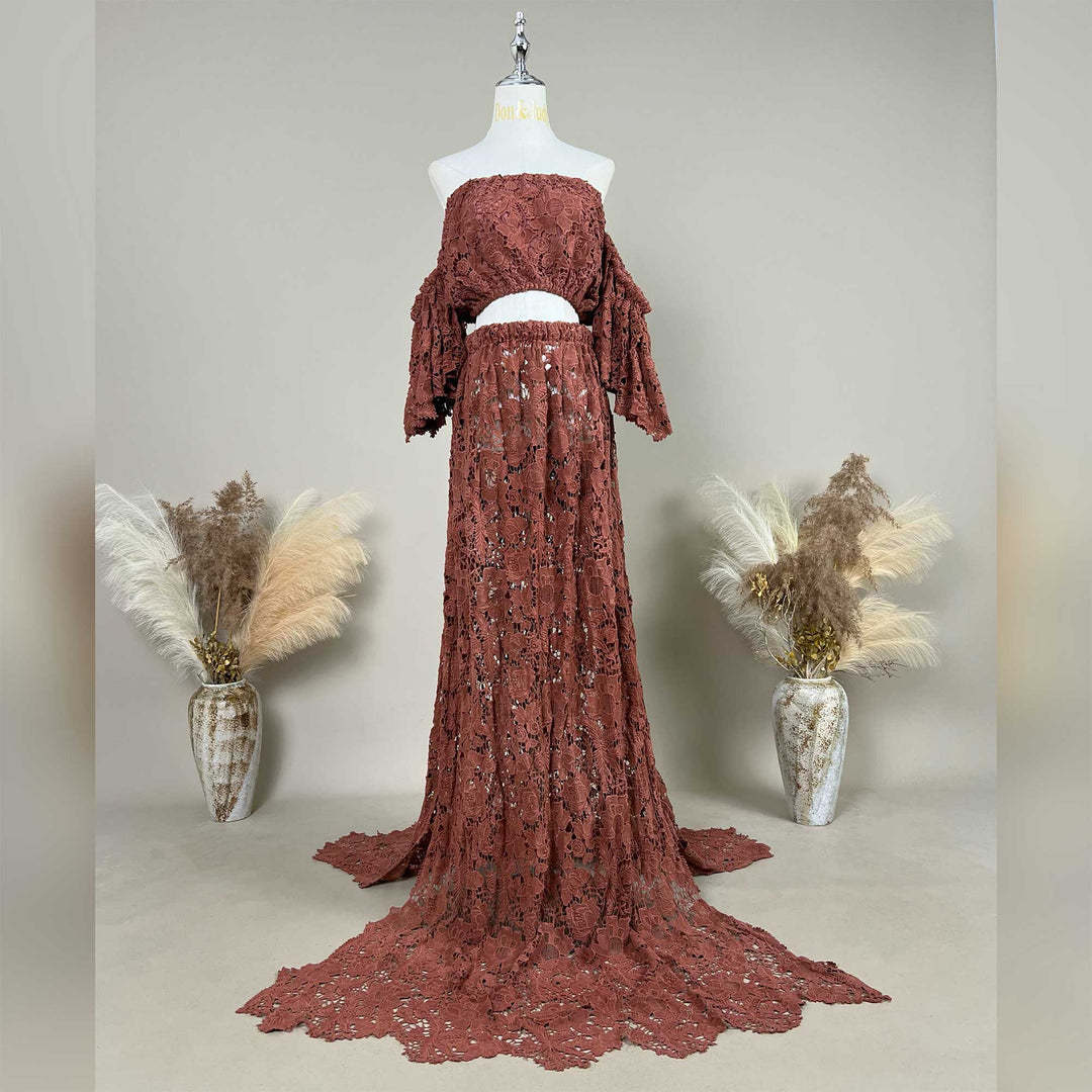 The Bendis,terracotta two-piece lace maternity photography set displayed on a mannequin, featuring an off-the-shoulder ruffled crop top and a high-waisted floor-length skirt with a sweeping train