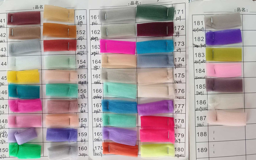 A large grid of small fabric swatches in many colors arranged on a white measurement chart with printed numbers. This is a Oreades dress color-options reference image rather than a single product photo, so subject_type is Color Swatch.